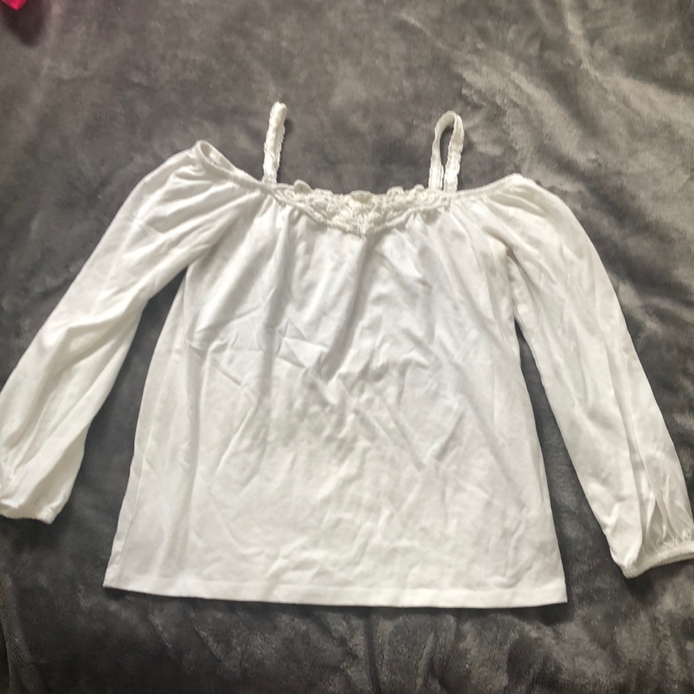 White off the shoulder, long sleeve shirt.